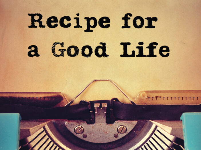 Typewriter loaded with paper with words Recipe for a Good Life